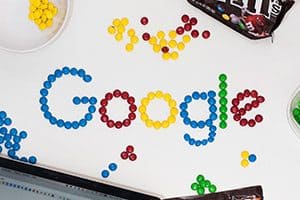 Mobile ad with Google spelled out with M&Ms. 